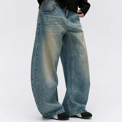 Wide-Leg Washed Blue Jeans with Curved Seam Detail