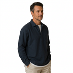 Navy popover shirt on a male model in his forties, side view on white background