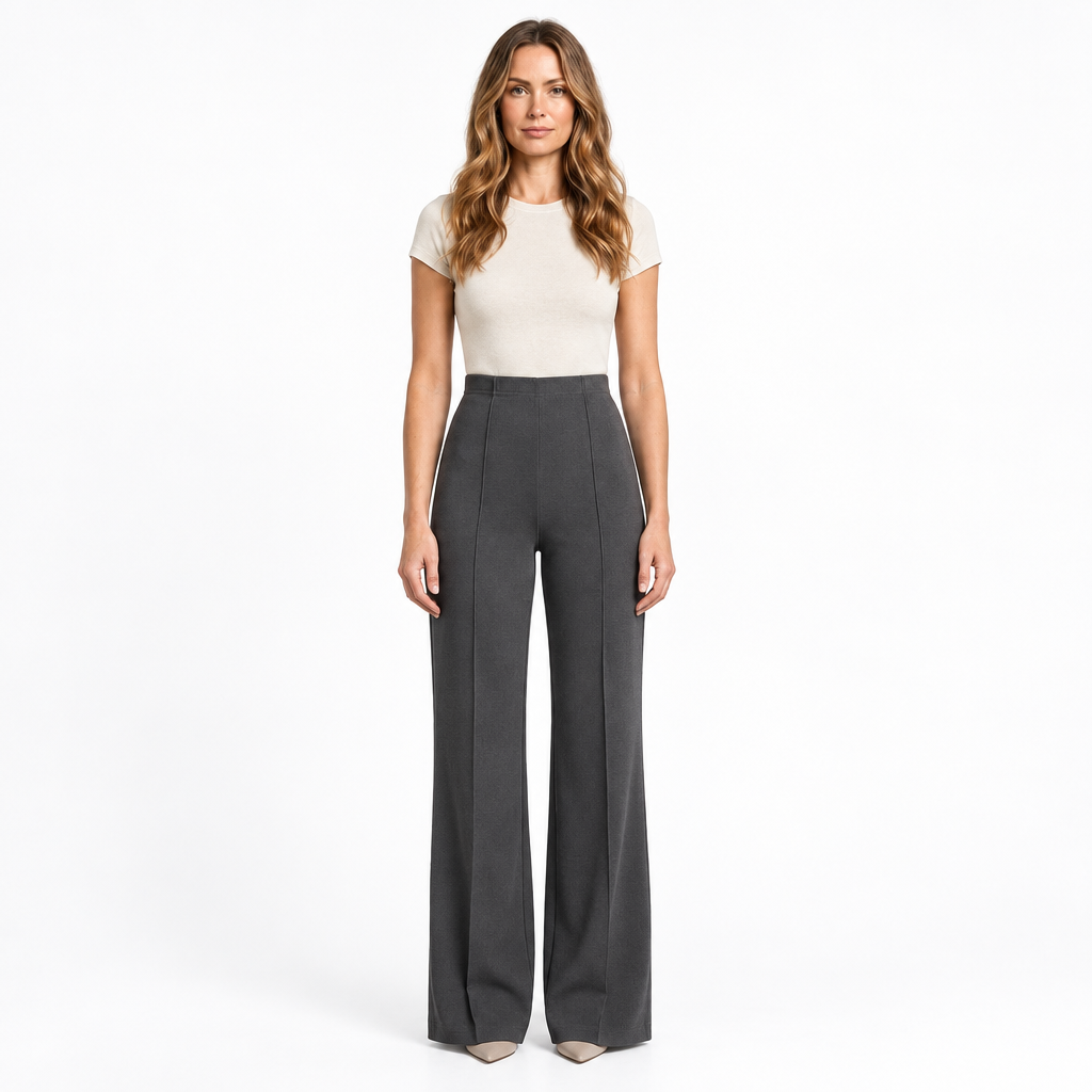Woman modelling grey wide-leg trousers on a white background