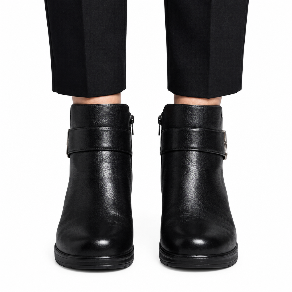 Black ankle boots worn by model
