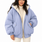 Woman modelling a blue hooded puffer jacket