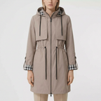 Woman modelling beige hooded zip coat