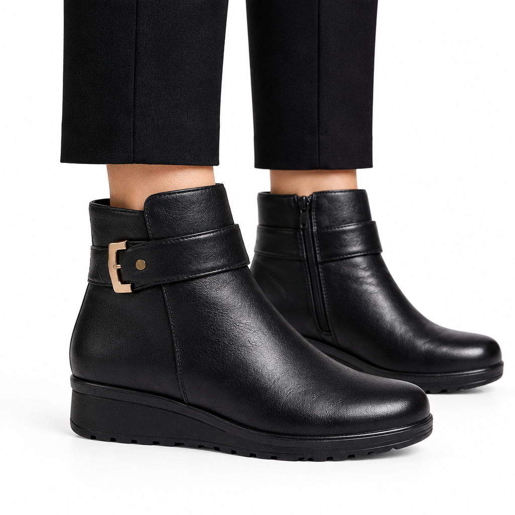 Black ankle boots on model, side view