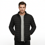 Man modelling black quilted jacket, front view on white background