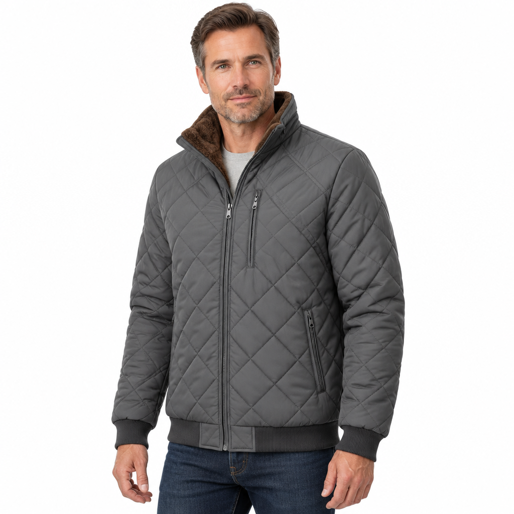Man modelling a grey diamond-quilted jacket on a white background