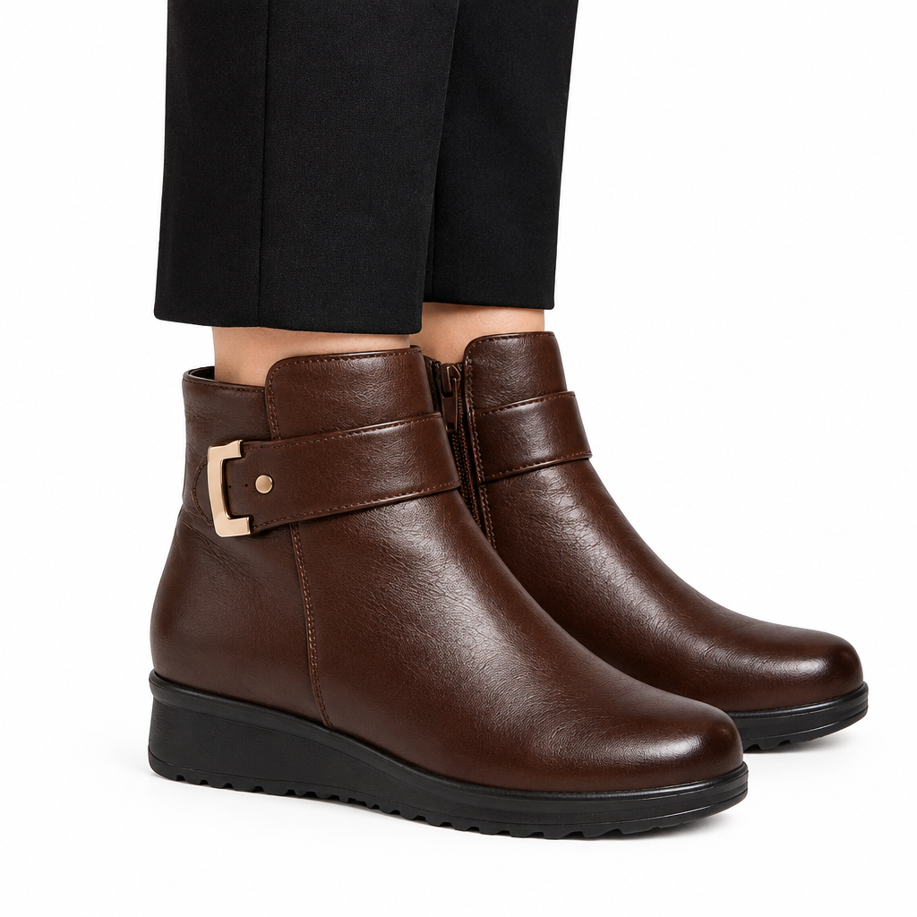 Brown ankle boots on model, side view